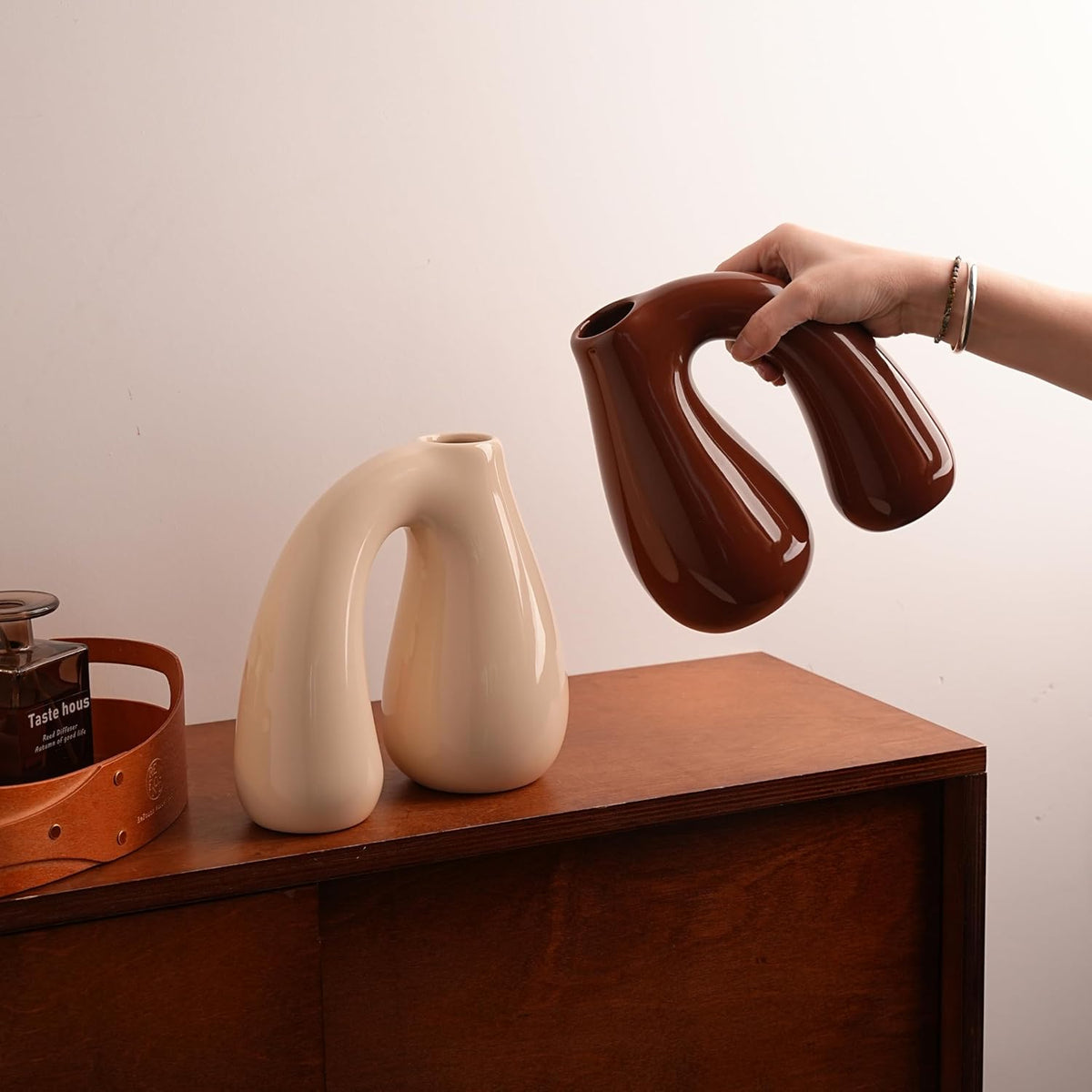 Brown Ceramic Vase – Glossy Modern Sculptural Décor, Arch Handle Artistic Design, Warm Earth-Tone