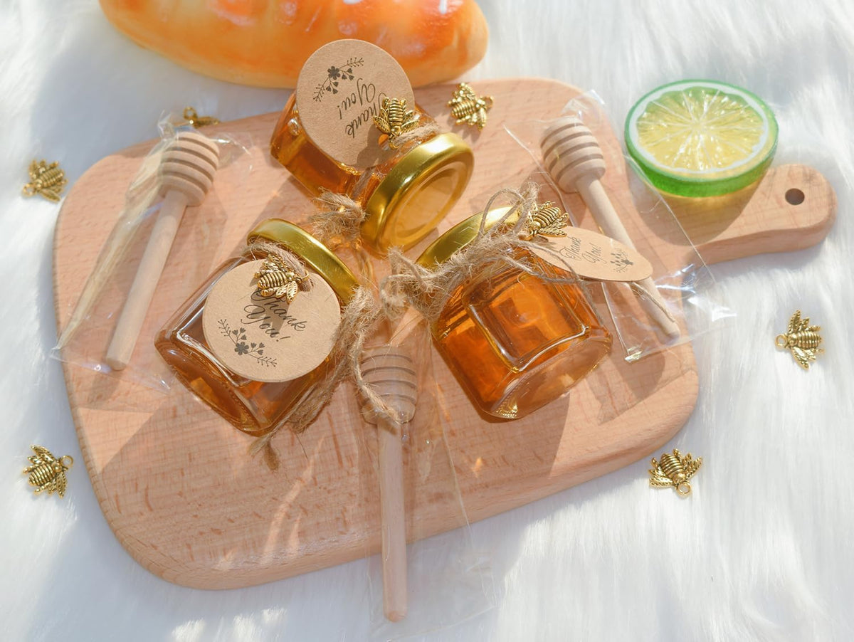 IIKUM 20 Pack Glass Honey Jars, 1.5 oz Hexagon Honey Pots with Lids, Wooden Dippers, Bee Pendants
