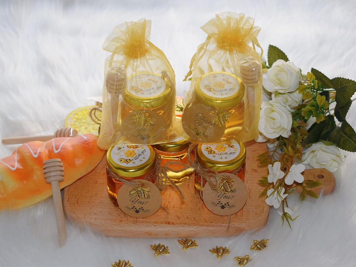 IIKUM 60 Pack 1.5 oz Hexagon Mini Glass Honey Jars with Wooden Dippers, Bee Pendants, Gift Bags