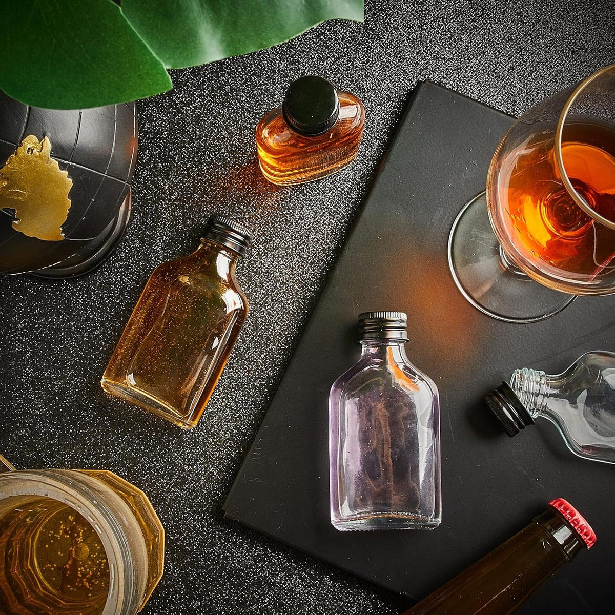 Patelai 16 Pcs Clear Glass Bottles with Caps Mini Glass Flask Liquor Bottles Empty Alcohol Shot
